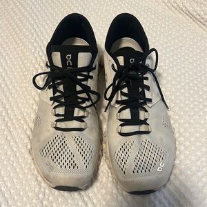 On Running White and Black Athletic Shoes